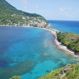Aerial view of Boiling Lake in Dominica surrounded by lush rainforest — one of the top things to do on the Nature Island