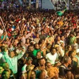 Crowd enjoying the World Creole Music Festival in Dominica with live music and dancing