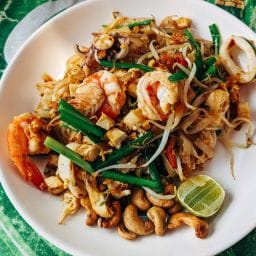 Creole dish on wooden table with island herbs