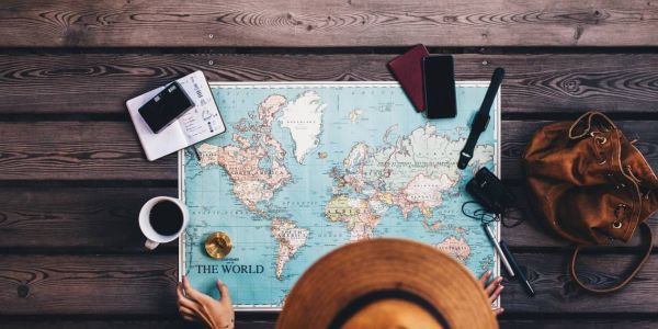 Tourist holding a Dominica map with visitor information