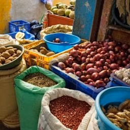 People celebrating Creole Day in Dominica wearing madras clothing, dancing and enjoying traditional food
