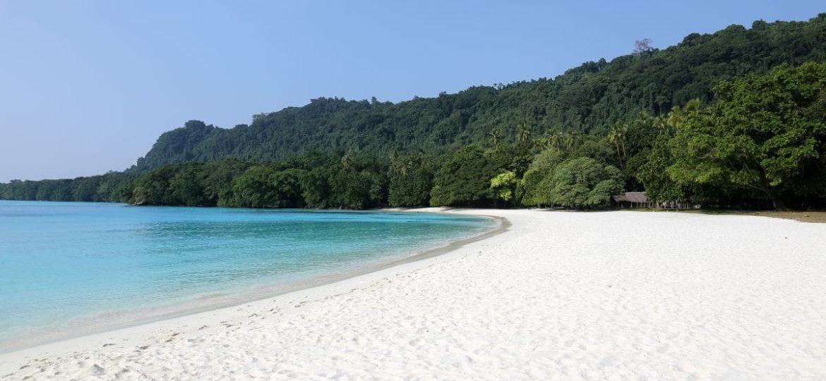 Swimmer snorkeling in clear water at Champagne Beach in Dominica