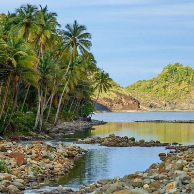Photographer capturing sunset over Scott’s Head beach in Dominica