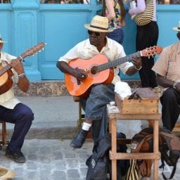 Dominican musicians playing traditional drums and bamboo instruments