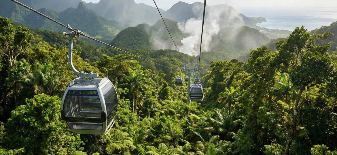 A modern Dominica Cable Car cabin gliding over the dense rainforest towards the Boiling Lake.
